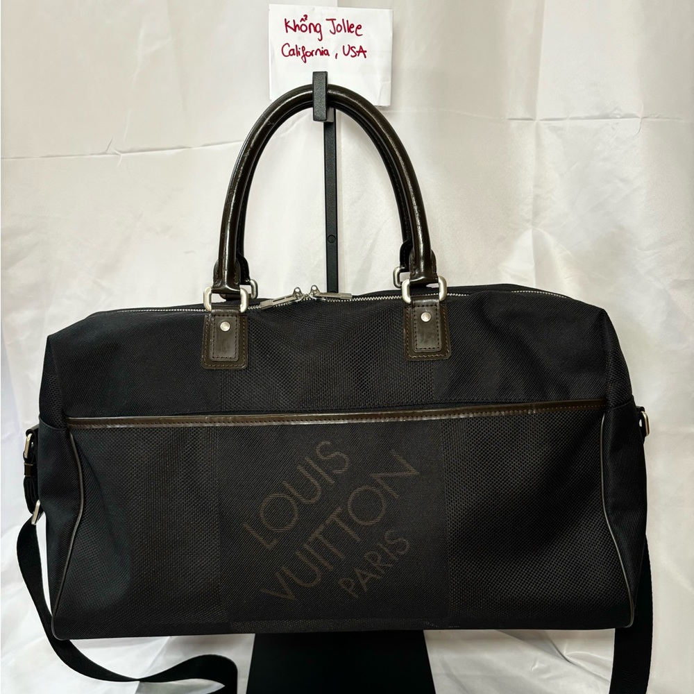 Black Damier Geant Albatross Duffel with strap.